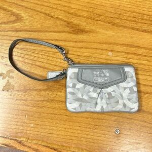 Coach brand wristlet silver and gray color